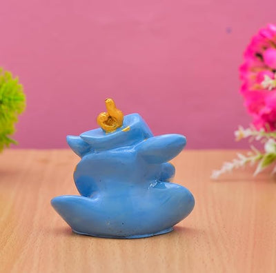 Handmade Ganesha idol in resin for car dashboard, measuring 5.1 cm x 5.1 cm x 7.6 cm, perfect for bringing blessings on the road