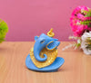 Handmade Ganesha idol in resin for car dashboard, measuring 5.1 cm x 5.1 cm x 7.6 cm, perfect for bringing blessings on the road