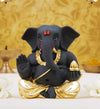 Handmade ceramic Ganesha idol, beautifully crafted as a showpiece, ideal for altars or car dashboards, showcasing intricate details and divine charm