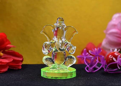 Handmade glass Ganesha idol, beautifully crafted as a showpiece, ideal for altars or car dashboards, showcasing intricate details and divine elegance.