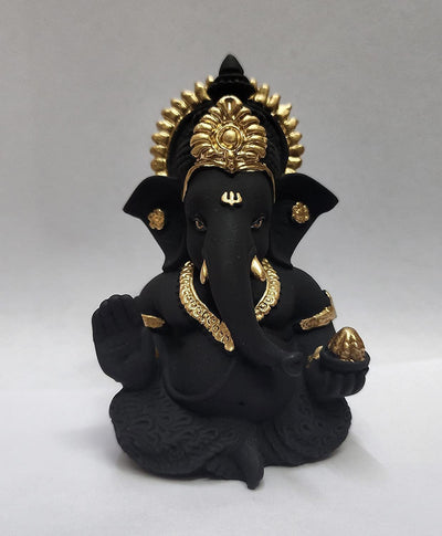 Handmade Ganesha idol in resin, symbolizing prosperity and wisdom, perfect for home altar or car dashboard