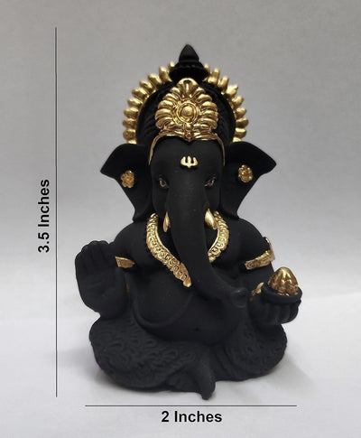 Handmade Ganesha idol in resin, symbolizing prosperity and wisdom, perfect for home altar or car dashboard.