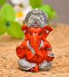 Handmade Ganesha idol in resin for car dashboard, measuring 5.1 cm x 5.1 cm x 7.6 cm, designed to bring blessings and positivity while driving.
