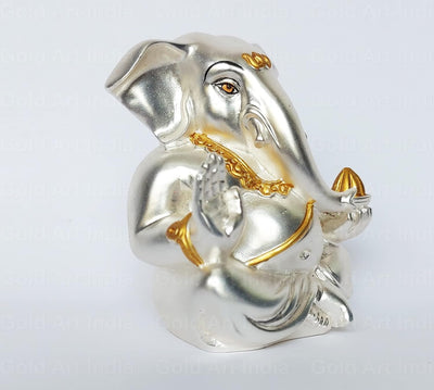 Handmade Ganesha idol crafted from resin, perfect for altar or car dashboard, showcasing intricate details and vibrant colors.