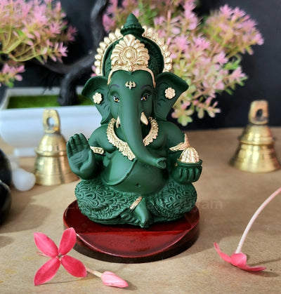 Handmade Ganesha idol made from high-quality resin, measuring 3.5 cm, symbolizing wisdom and prosperity, perfect for home decor and altars."