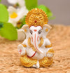 Handmade Ganesha idol in resin for car dashboard, measuring 5.1 cm x 5.1 cm x 7.6 cm, perfect for bringing blessings and positivity while driving