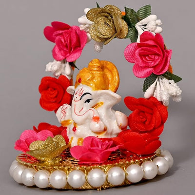 "Handmade Ganesha Idol crafted from resin, symbolizing prosperity and wisdom, ideal for home and car decoration."
