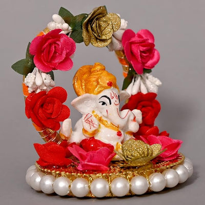 "Handmade Ganesha Idol crafted from resin, symbolizing prosperity and wisdom, ideal for home and car decoration."