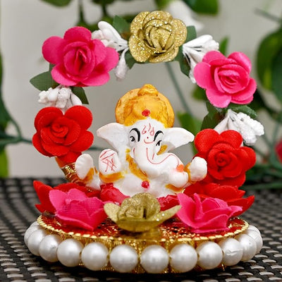 "Handmade Ganesha Idol crafted from resin, symbolizing prosperity and wisdom, ideal for home and car decoration."