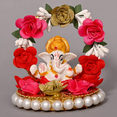 "Handmade Ganesha Idol crafted from resin, symbolizing prosperity and wisdom, ideal for home and car decoration."
