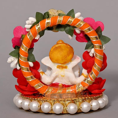 "Handmade Ganesha Idol crafted from resin, symbolizing prosperity and wisdom, ideal for home and car decoration."