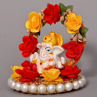 Handmade Ganesha idol crafted from high-quality resin, featuring intricate details, perfect for home and car decoration, symbolizing prosperity and wisdom.
