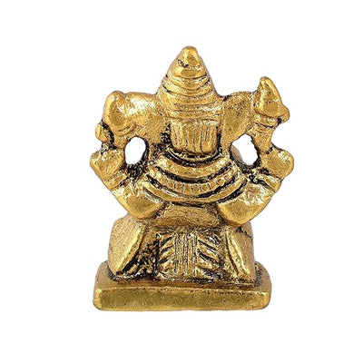 "Handmade Ganesha idol in metal for car dashboard, featuring intricate details and a sleek finish, perfect for inviting blessings on every journey."