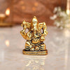 "Handmade Ganesha idol in metal for car dashboard, featuring intricate details and a sleek finish, perfect for inviting blessings on every journey."