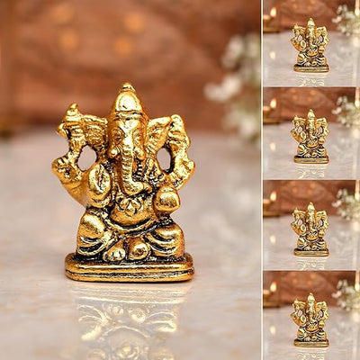 "Handmade Ganesha idol in metal for car dashboard, featuring intricate details and a polished finish, perfect for inviting blessings on every journey."