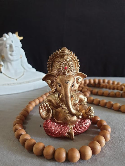 "Handmade Ganesha idol in resin for car dashboard, featuring intricate details and vibrant colors, perfect for inviting blessings on every journey."