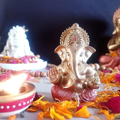 "Handmade Ganesha idol in resin for car dashboard, featuring intricate details and vibrant colors, perfect for inviting blessings on every journey."