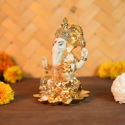 Handmade ceramic Ganesha idol, intricately designed, symbolizing prosperity and wisdom, perfect for altars and car dashboards."
