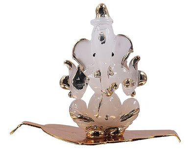 Handmade glass Ganesha idol, an elegant showpiece ideal for altars or car dashboards, showcasing intricate craftsmanship and divine charm."