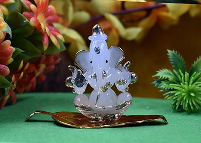 Handmade glass Ganesha idol, an elegant showpiece ideal for altars or car dashboards, showcasing intricate craftsmanship and divine charm."