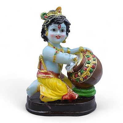Handmade Lord Krishna Makhan Chor idol, crafted from resin with intricate detailing and vibrant colors, symbolizing joy and innocence