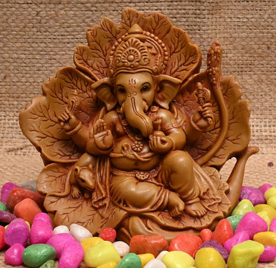 Handmade resin Ganesha idol, intricately designed, depicting Lord Ganesha in a majestic pose, perfect for home decoration and spiritual blessings."