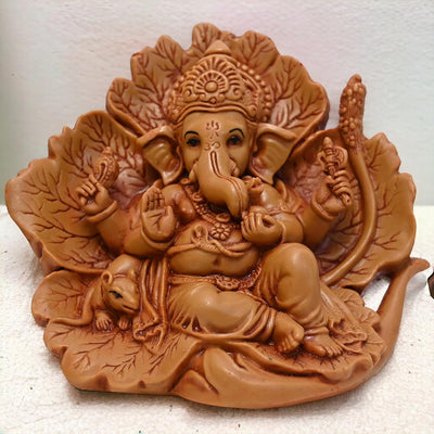 Handmade resin Ganesha idol, intricately designed, depicting Lord Ganesha in a majestic pose, perfect for home decoration and spiritual blessings."