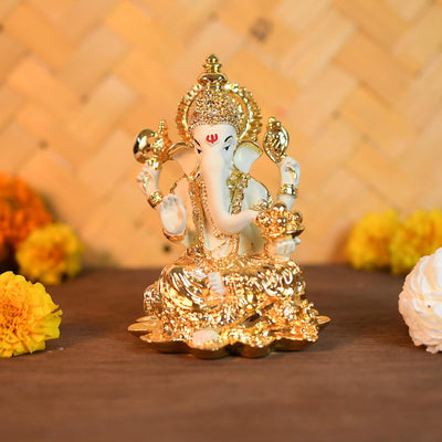 "Handmade ceramic Ganesha idol, intricately designed, symbolizing prosperity and wisdom, perfect for altars and car dashboards."