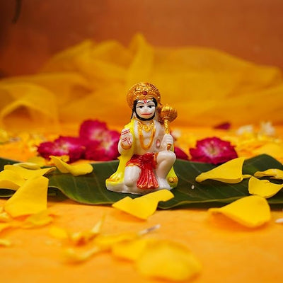 Handmade resin statue of Lord Hanuman, showcasing intricate details, ideal for altars and spiritual decor.