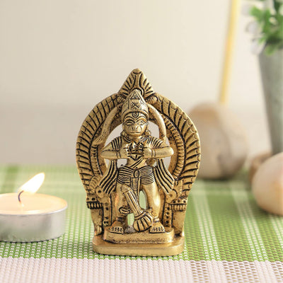Handcrafted brass idol of Lord Hanuman, intricately designed, symbolizing strength and devotion, ideal for altars and home decor.