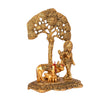 Exquisite Kamadhenu cow statue crafted from metal with a golden finish, symbolizing wealth and abundance in Hindu culture.
