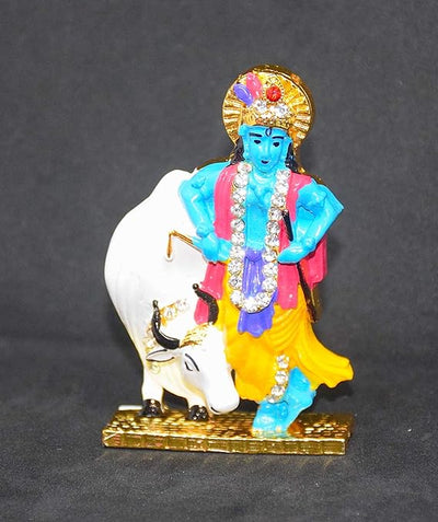 Handmade brass idol of Lord Krishna with the Kamadhenu cow, featuring intricate details, ideal for home altar or decor