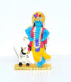 Handmade brass idol of Lord Krishna with the Kamadhenu cow, featuring intricate details, ideal for home altar or decor