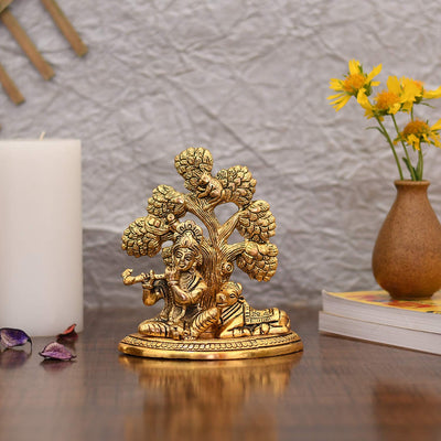 Handcrafted metal statue of Lord Krishna with the Kamadhenu cow, symbolizing abundance and prosperity, featuring intricate design details.