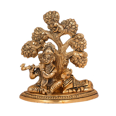 Handcrafted metal statue of Lord Krishna with the Kamadhenu cow, symbolizing abundance and prosperity, featuring intricate design details.