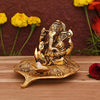 Handmade brass Lord Ganesh diya idol, symbolizing prosperity and wisdom, perfect for home altars, featuring intricate design and vibrant detail.