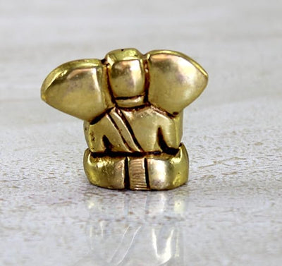 Handmade brass Lord Ganesh idol (0.4 cm x 0.6 cm x 1.2 cm), symbolizing wisdom and prosperity, perfect for pooja rooms and gifts.