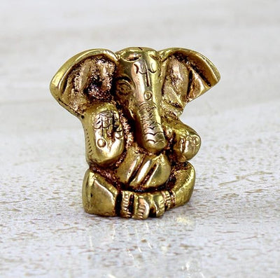 Handmade brass Lord Ganesh idol (0.4 cm x 0.6 cm x 1.2 cm), symbolizing wisdom and prosperity, perfect for pooja rooms and gifts.