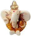Handmade resin Lord Ganesh idol for car dashboard, symbolizing wisdom and protection, featuring intricate detailing in a compact size.