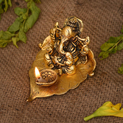 Handmade metal Lord Ganesh idol, perfect for home decor or puja gifts, symbolizing wisdom and prosperity with intricate detailing.