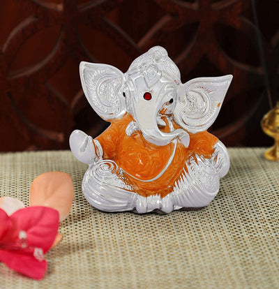Handmade plastic Lord Ganesh idol (7 cm x 5.5 cm), perfect for gifts, featuring vibrant colors and intricate details, symbolizing wisdom and prosperity.