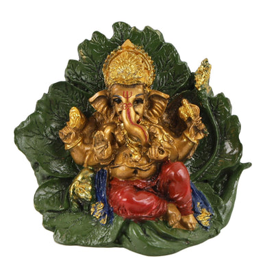 Handmade resin Lord Ganesh idol for pooja rooms, featuring detailed craftsmanship and vibrant colors, symbolizing wisdom and prosperity.