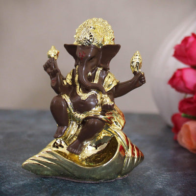 Handmade resin Lord Ganesh idol (7.5 cm x 6 cm) featuring intricate details, symbolizing wisdom and prosperity, perfect for gifts and pooja rooms.