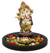 Handmade resin Lord Ganesh idol for pooja rooms, featuring intricate details and vibrant colors, symbolizing wisdom and prosperity.