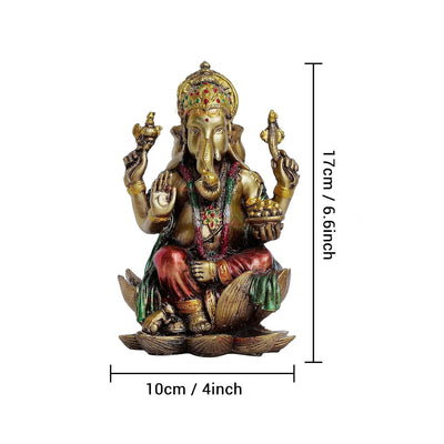 Handmade resin Lord Ganesh idol for pooja rooms, showcasing intricate details and vibrant colors, symbolizing wisdom and prosperity.