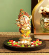 Handmade resin Lord Ganesh idol for pooja rooms, featuring intricate details and vibrant colors, symbolizing wisdom and prosperity.
