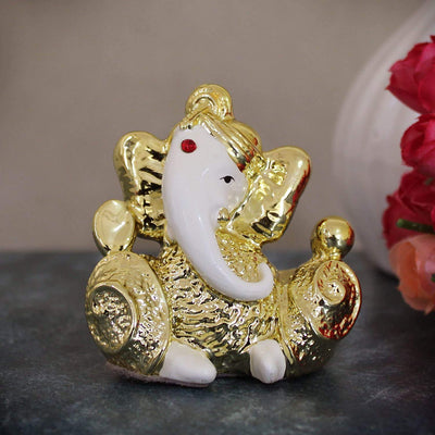 Handmade resin Lord Ganesh idol (6.3 cm x 6 cm) for car dashboards, symbolizing wisdom and prosperity, enhancing your driving experience.