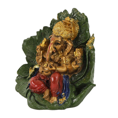 Handmade resin Lord Ganesh idol for pooja rooms, featuring detailed craftsmanship and vibrant colors, symbolizing wisdom and prosperity.