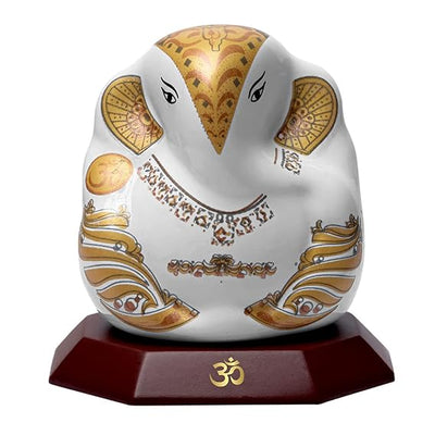 Handmade Lord Ganesh idol for car dashboard and home decor, crafted from ceramic, measuring 5.5L x 3.5W x 5.5H cm, symbolizing wisdom and prosperity
