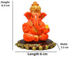 Handmade Lord Ganesh idol for car dashboard and home decor, crafted from resin, measuring 6L x 3.5W x 6.5H cm, symbolizing wisdom and good fortune